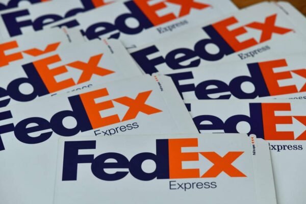 FedEx hopes to save $1 billion this fiscal year. But its profit forecast is still sinking shares, as tariffs weigh on shipments.